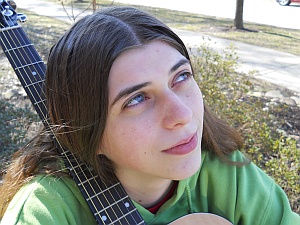 Mary with her guitar.